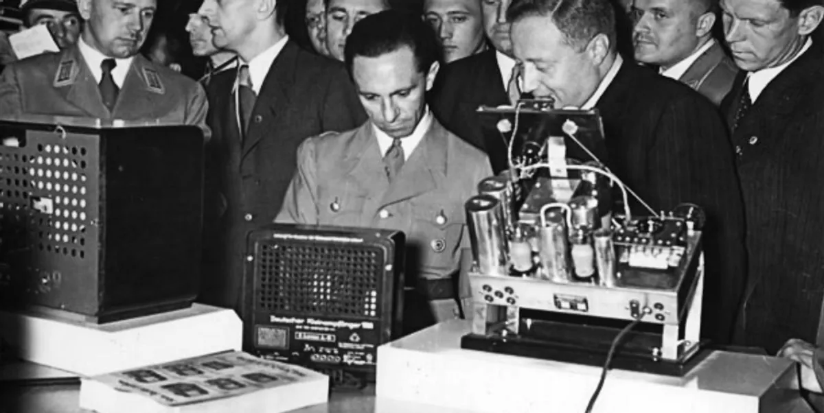 Nazi propaganda chief joseph goebbels center checking radio devices in 1938